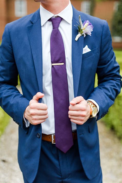 purple tie with blue suit.